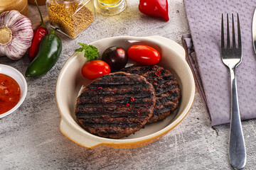 Grilled burger cutlet with sauce