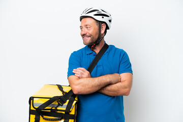 Middle age caucasian man with thermal backpack isolated on white background looking side