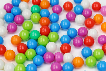 Obraz premium A white with balls and toys. Baby car abstract concept. A game of ball with colored balls on a white . A white and colored board game with balls and toys lifestyle.