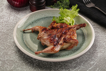 Grilled quail in the plate