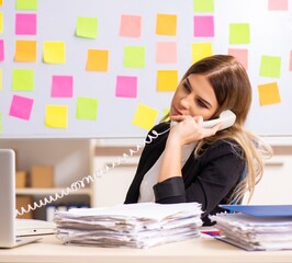 Fototapeta premium Young beautiful businesslady in conflicting priorities concept