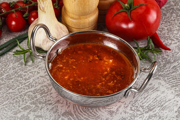 Hot tomato soup with diced chicken