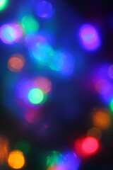 different blurred multicolor light spots. new year holiday background