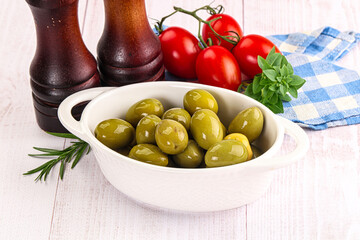Green marinated olives in the bowl