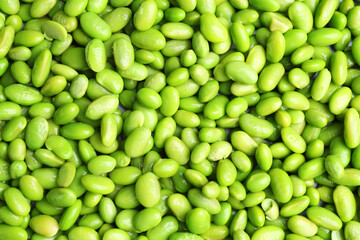 Fresh edamame beans as background, top view