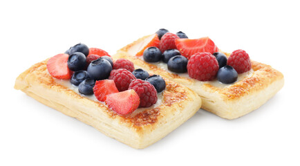 Tasty puff pastries with berries isolated on white