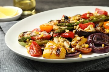 Delicious salad with grilled vegetables on table, closeup view