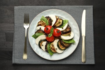 Tasty salad with grilled vegetables and mozzarella cheese served on wooden table, flat lay