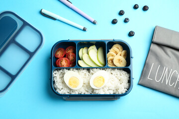 Bag, lunch box with snacks and pens on light blue background, flat lay