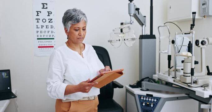 Mature woman, optometry and tablet for research, consultation and technology for medical service. Mexican person, optometrist and checking results or eye care, internet and healthcare in office