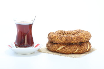 turkish tea and turkish bagels (simit) on white background