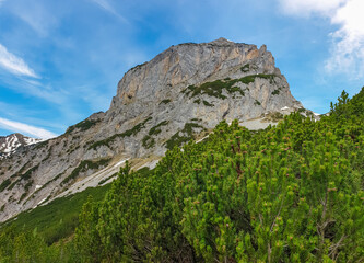 Panoramic view of majestic mountain peak Sinabell and Wasenspitze in Schladming, Schladminger Tauern, Styria, Austria. Hiking trail in Austrian Alps in spring. Remote alpine landscape. Wanderlust