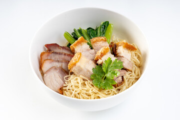 Red pork and crispy pork noodles isolated on white background
