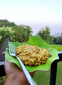 Beautiful view of Fried Maggi noodles on banana leaf in the mountains