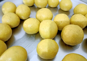 Besan ladoo or laddu are delicious sweet balls made with gram flour, sugar, ghee cardamoms, indian mithai