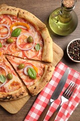 Delicious vegetarian pizza served on wooden table, flat lay