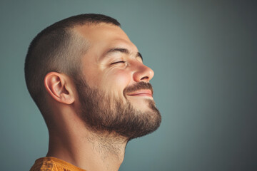 A close up of a man's face with her eyes closed
