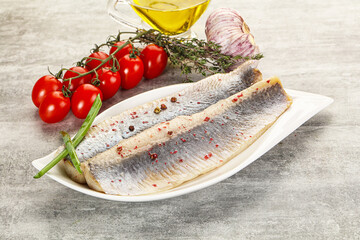 Marinated herring fillet with green onion