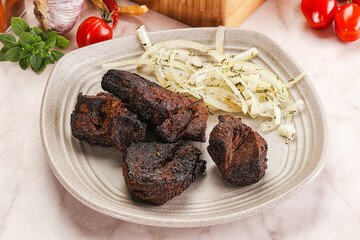 Grilled beef barbecue served onion