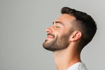 Fototapeta premium A close up of a man's face with her eyes closed