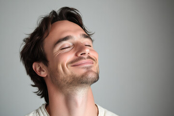 Fototapeta premium A close up of a man's face with her eyes closed