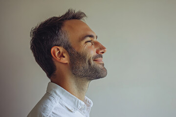 Fototapeta premium A close up of a man's face with her eyes closed