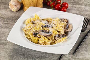 Italian cuisine - farfalle with mushrooms