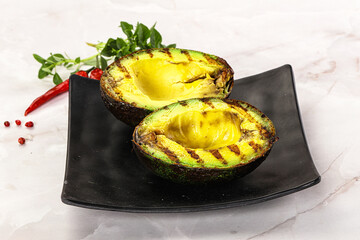 Sliced fresh avocado on the grill