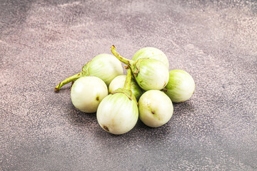 Small organic young green round eggplant