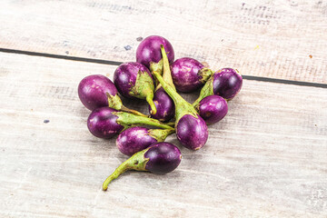Small organic young purple round eggplant