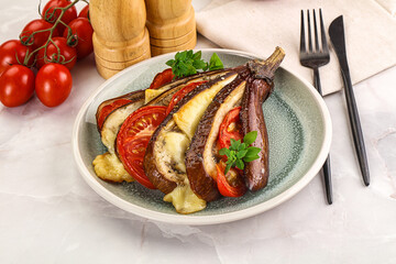 Baked tomato with mozzarella and tomato