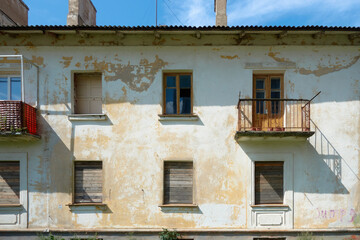 facade, balconies and windows of abandoned long ago house