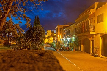 Image of a deserted street in a historic Spanish village in artificial light