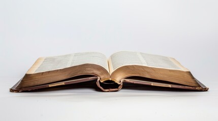 Fototapeta premium Vintage open book with aged pages on a white backdrop, radiating wisdom and elegance, ideal for reading, education, and library themes