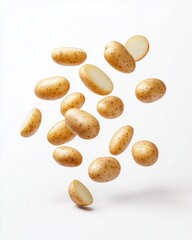Obraz premium Falling potatoes isolated on a white background, top view