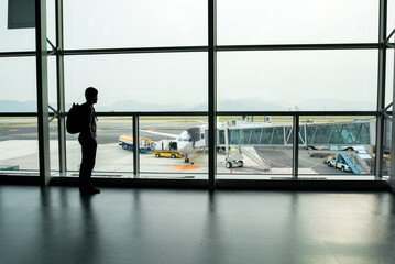 travel,Backpack tourists waiting flight on the gate in airport for summer trip.

trip Summer flight...