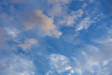 Soft Orange Clouds Float in the Sky at Dusk