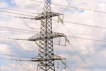 High voltage towers with sky background. Power line support with wires for electricity...