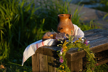 Rustic Still Life Featuring a Pot and Bread Surrounded by the Beauty of Nature Outdoors