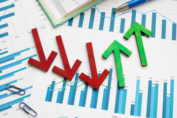 Rising arrows after a decline on a financial chart, symbolizing recovery and growth.