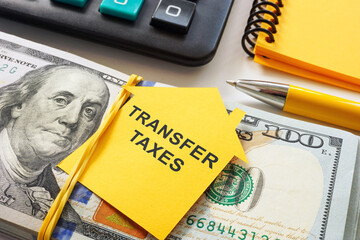 Outline of a house with the phrase Transfer Taxes and cash. Real estate transactions.