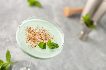 Grasshopper cocktail  from New Orleans, with green mint liqueur, chocolate liqueur and cream in cocktail glass.