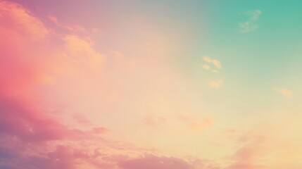 Obraz premium A pastel-colored sky at sunset with soft clouds over a tranquil landscape