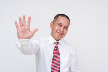 A middle aged asian manager making a hi-five gesture with his hand. Gesture of friendship and teamwork. Isolated on a white background.