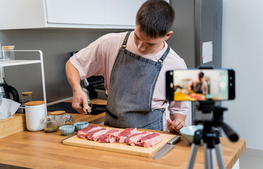 The chef is broadcasting live from workshop how to prepare a beef steaks on the electric grill