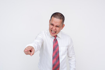 An irate middle aged asian manager scolding an employee from a higher vantage point. Isolated on a...