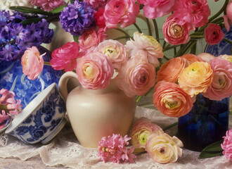 Ranunculus and hyacinth still life in jugs and vases, 