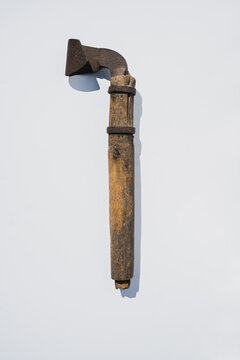 Closeup of a turpentine hack against a white background. The tool was used for scraping off pine bark from longleaf pine trees to make the sap flow.