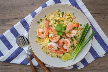 Fried rice with shrimps on a white plate