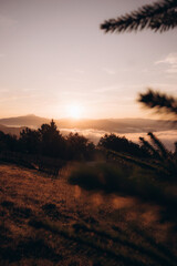 Golden Sunrise Over Misty Mountain Landscape